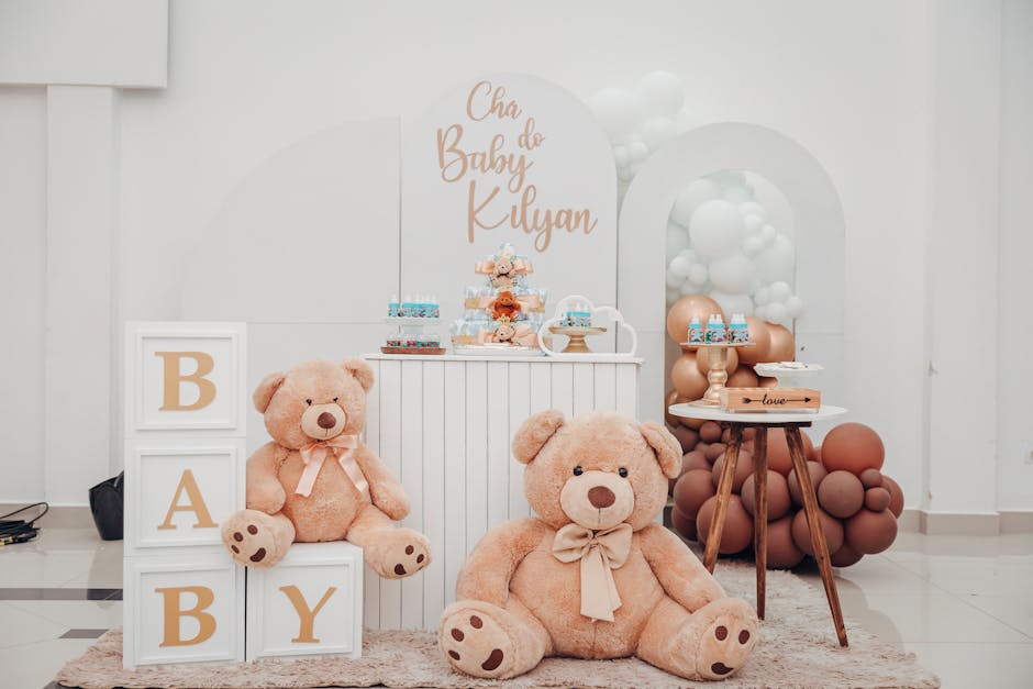 Chic baby shower decor featuring teddy bears, balloons, and sweet treats in an indoor setting.